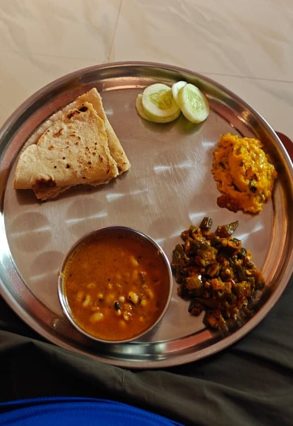 Warm clay-oven flatbreads served with homegrown sides
