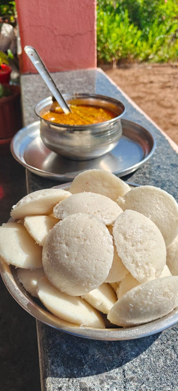 Steaming fermented idlis, a standard farm breakfast